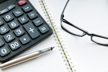 Business concept with notepad and calculator