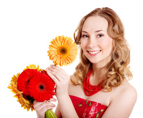 Happy young woman holding flowers.