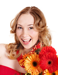 Happy young woman holding flowers.