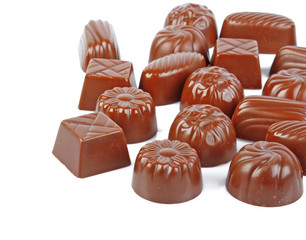 tasty sweet chocolate candy with nut on white background