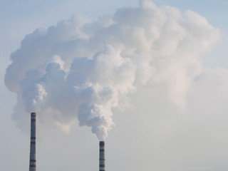 White clouds of steam coming out of the pipes.