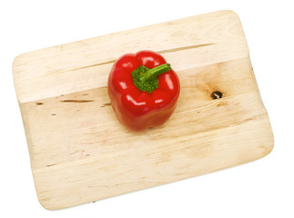 red paprika on wooden board