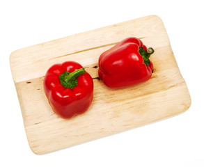 red paprika on wooden board