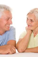 elderly couple  on a white