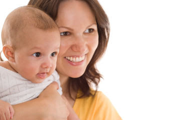 mother stands and holds the baby