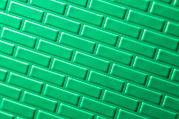 Wall of metallic bricks