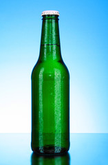 Bottle of beer on blue background