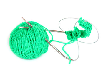 Knitting yarn and  knitting needles on white
