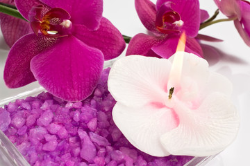 Fototapeta na wymiar Aroma candle, bath salt and orchid for aromatherapy