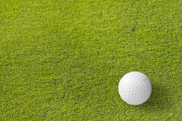 Golf ball on green tee