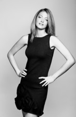 Fototapeta premium Young woman studio fashion portrait. Black and white.