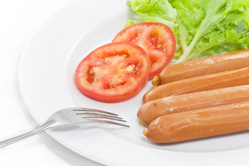 Fork in sausage plate