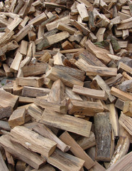 large stack of cut log for fireplace