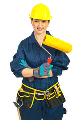 Worker woman holding paint roller