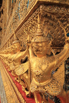 The Grand Palace in Bangkok. Gold ornamental patter statuettes.