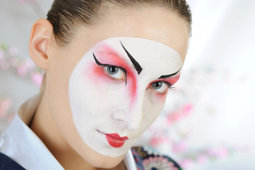 close-up artistic portrait of japan geisha woman with creative m