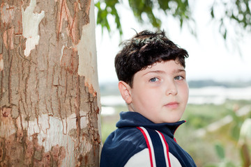 Young boy near the tree