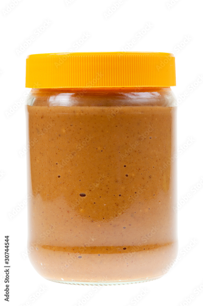 Wall mural Jar of peanut butter isolated