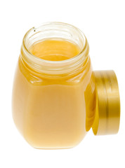 A jar of honey isolated