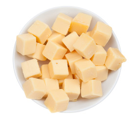 blocks of cheese in a bowl isolated