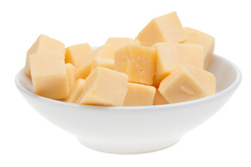 blocks of cheese in a bowl isolated