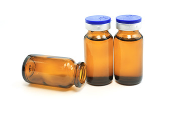 three glass bottles with medicine