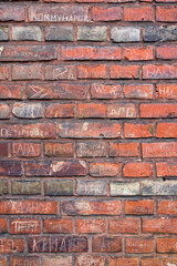 Brickwall with writings