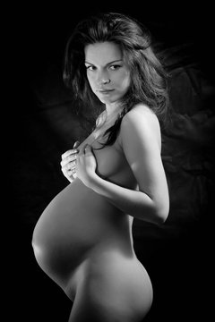 Black and white image of beautiful pregnant woman