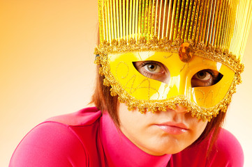 Attractive woman posing in the stylish mask