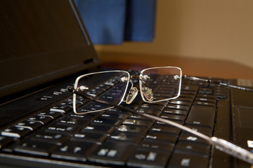 Glasses on laptop