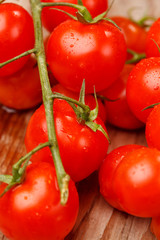 Cherry tomatoes on the wood background