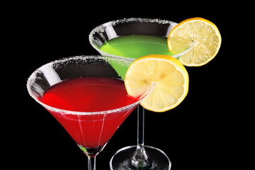 Martini glasses on black background