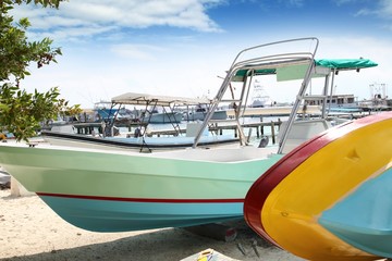 Fototapeta premium boats colorful in Isla Mujeres beach Mexico