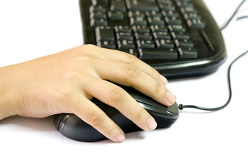 Hands click  on a mouse.