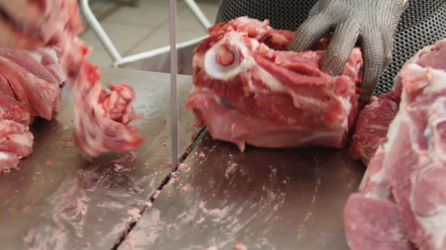 Preparing raw meat for cooking.