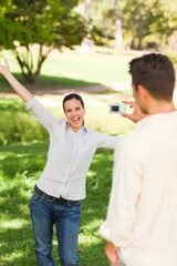 Man taking a photo of his girlfriend