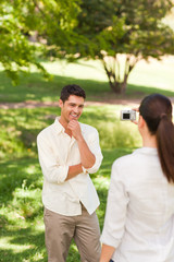 Woman taking a photo of her boyfriend