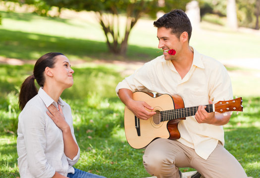 Man Playing Guitar For His Girlfriend