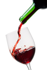Fototapeta na wymiar Red wine poured in a glass isolated on white background