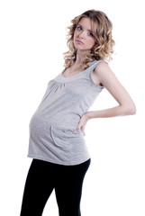 Fototapeta premium A pregnant woman with contractions or back pain..