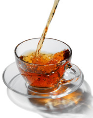 Tea flowing in cup