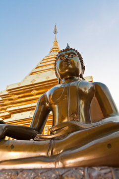 Buddha image with pagoda in background