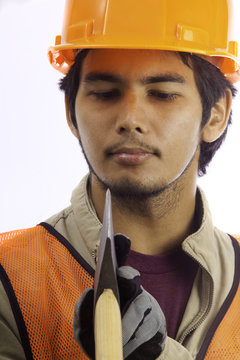 asian latino hard hat worker with an axe