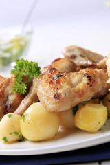 Roasted chicken wings and potatoes