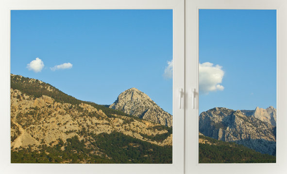 Fototapeta View to mountains through the window in early morning