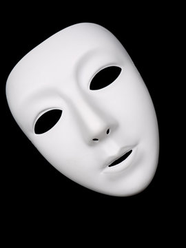 White theater mask isolated on black