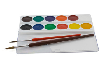 Naklejka premium Children's watercolors in a box with brushes to paint