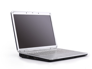 A modern laptop computer and wireless mouse with