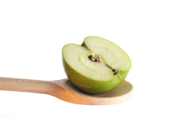Apple on a wooden spoon