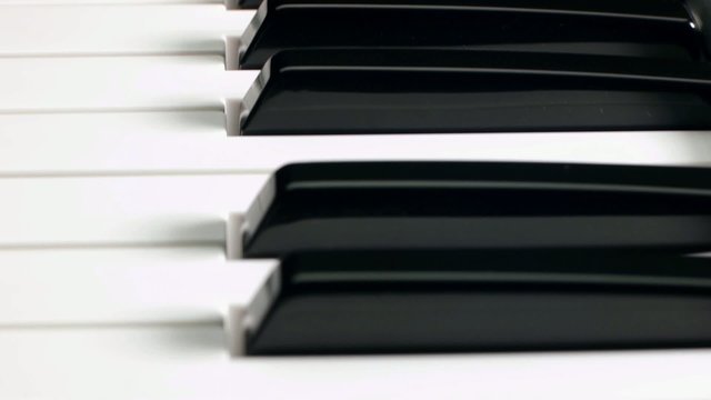 closeup of piano keyboard. Dolly shot
